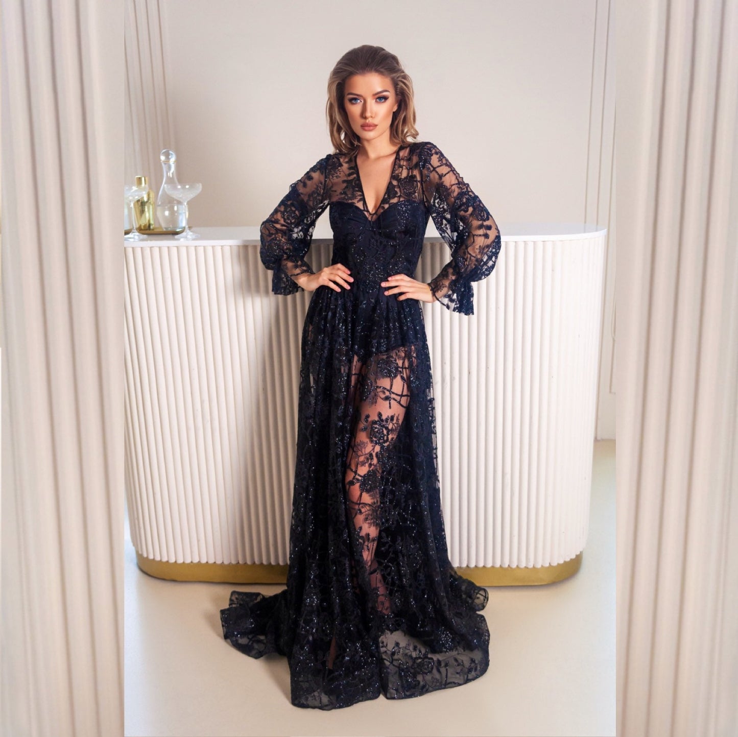 Black wedding dress with long puffy sleeves and fit and flare skirt with dramatic train. Floral glitter pattern. The dress is completed with silk bodysuit or slip dress. Perfect for goth bride and good choice for prom or any special occasion event.