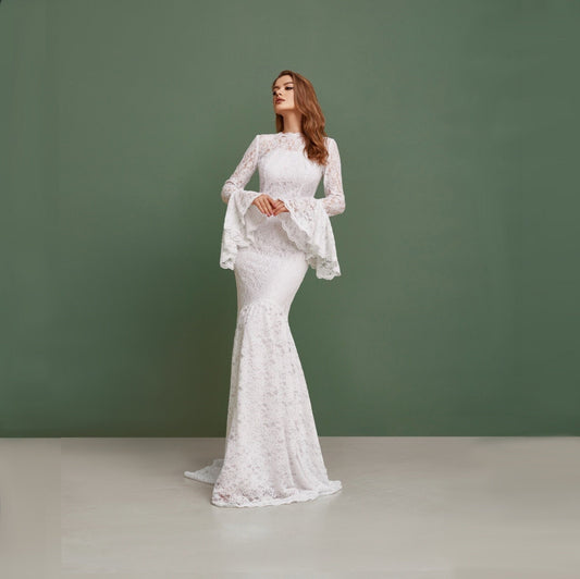 Simple wedding dress with bell sleeves and train. Mermaid silhouette is perfect for bohemian bride. Made from cord lace with pearl buttons on the back.