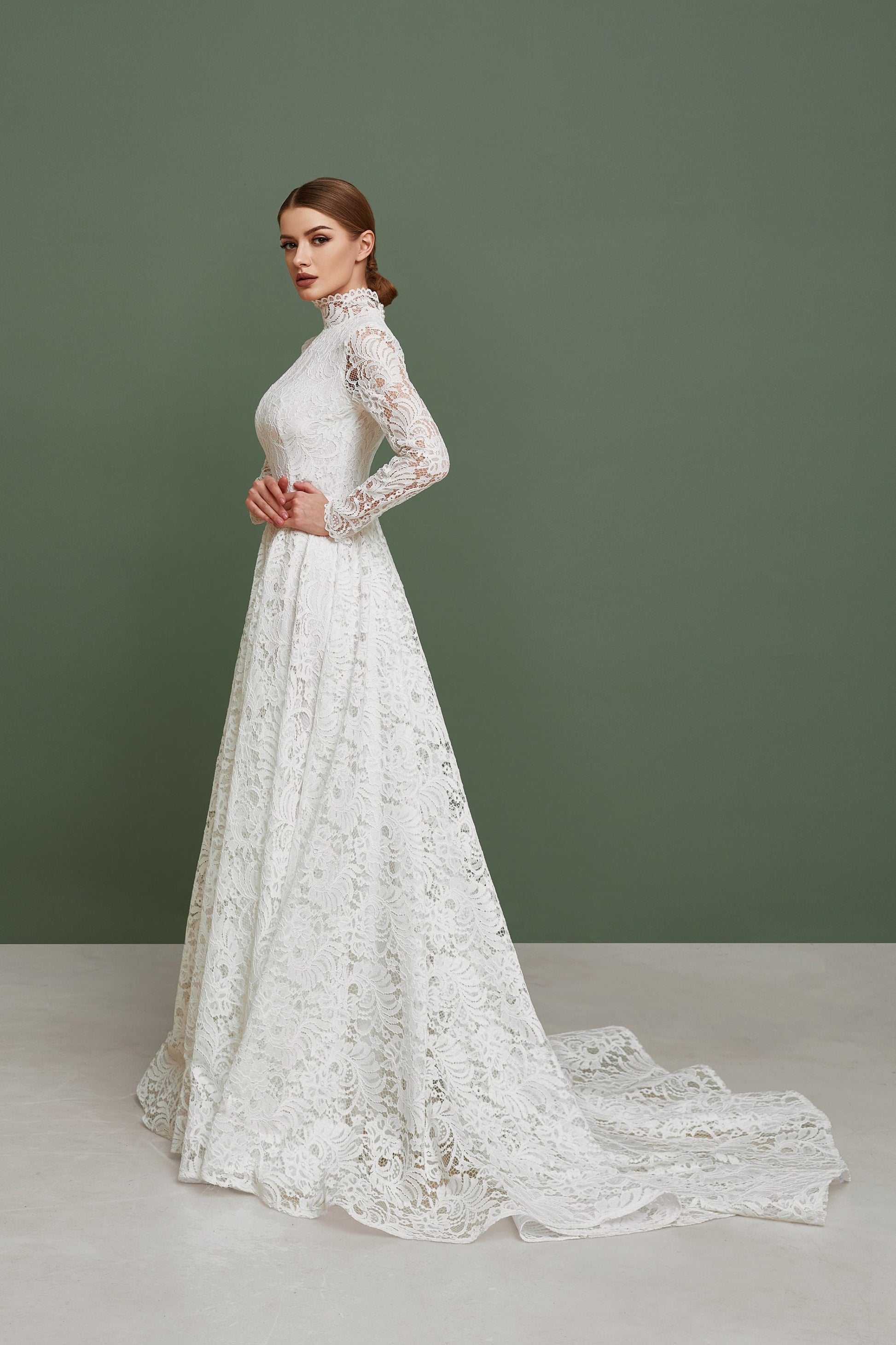 Modest wedding dress, muslim wedding dress, made from white lace. Gown has long sleeves and long train.