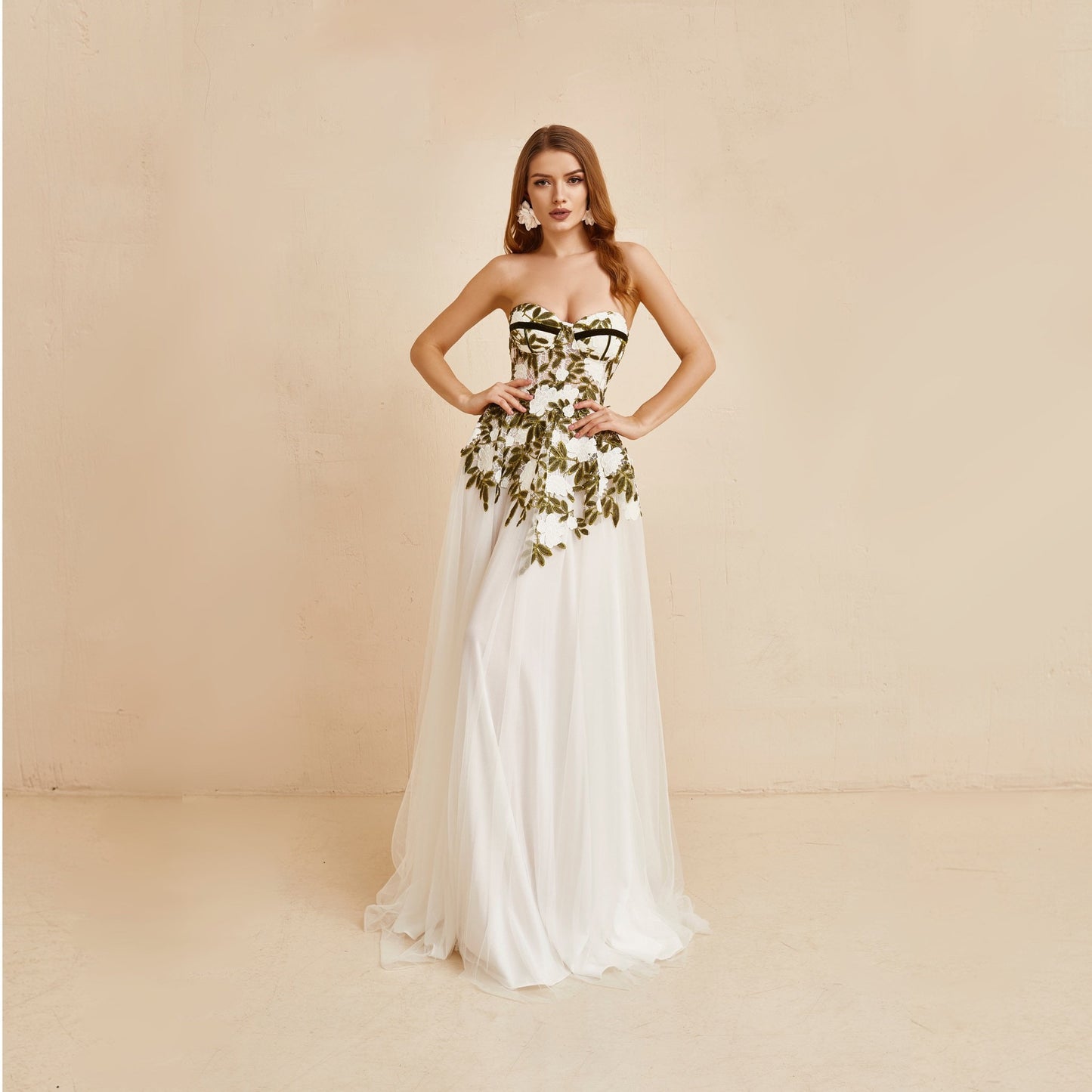 Floral wedding dress white and green colors with long tulle skirt. Bodice is hand embroidered with lace flowers and decorated with green velvet ribbon.
perfect for bohemian bride.