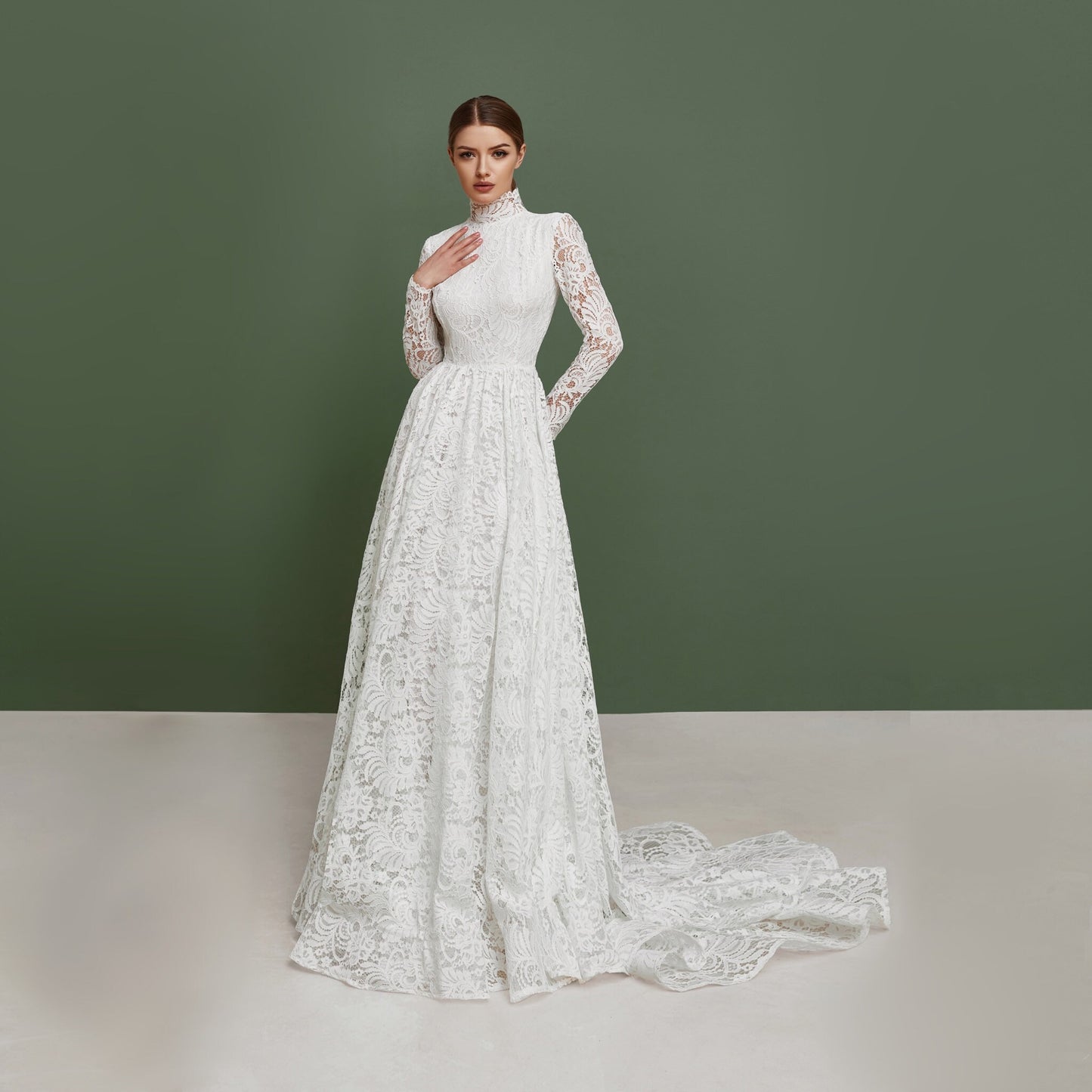 Simple wedding dress with long sleeves and train.
Made from thick lace and natural lining. Fit and flare skirt. Great for church ceremony. Perfect choice for modest bride.