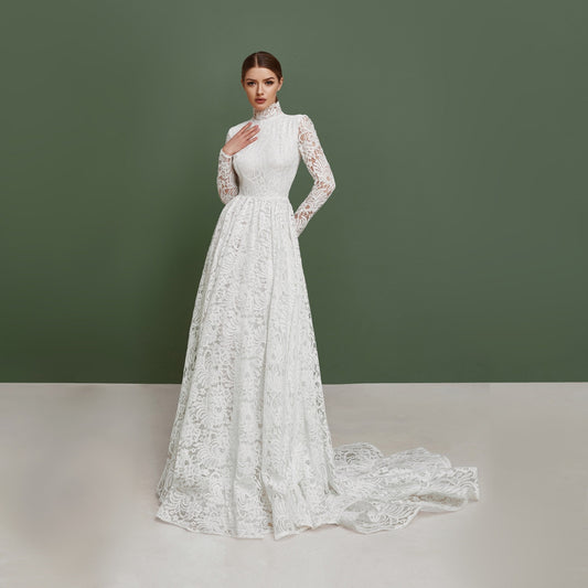 Simple wedding dress with long sleeves and train.
Made from thick lace and natural lining. Fit and flare skirt. Great for church ceremony. Perfect choice for modest bride.
