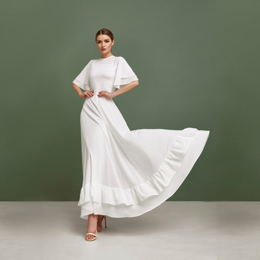 Simple wedding dress, fit and flare skirt, ruffled hem and short bell sleeves.
Perfect for modest bohemian bride.