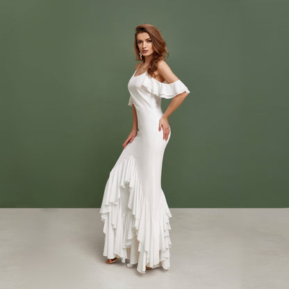 beach wedding pinafore made from white chiffon, with ruffles and floor length skirt.