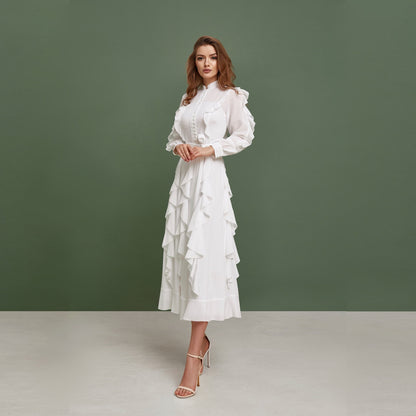 Modest chiffon wedding dress. Buttoned up, ankle length dress, with long sleeves and ruffled skirt.