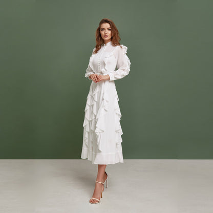 Modest chiffon wedding dress. Buttoned up, ankle length dress, with long sleeves and ruffled skirt.