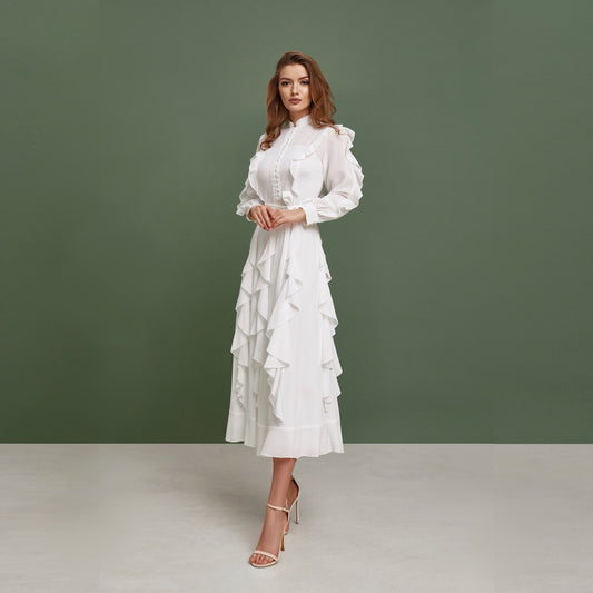 Modest chiffon wedding dress. Buttoned up, ankle length dress, with long sleeves and ruffled skirt.