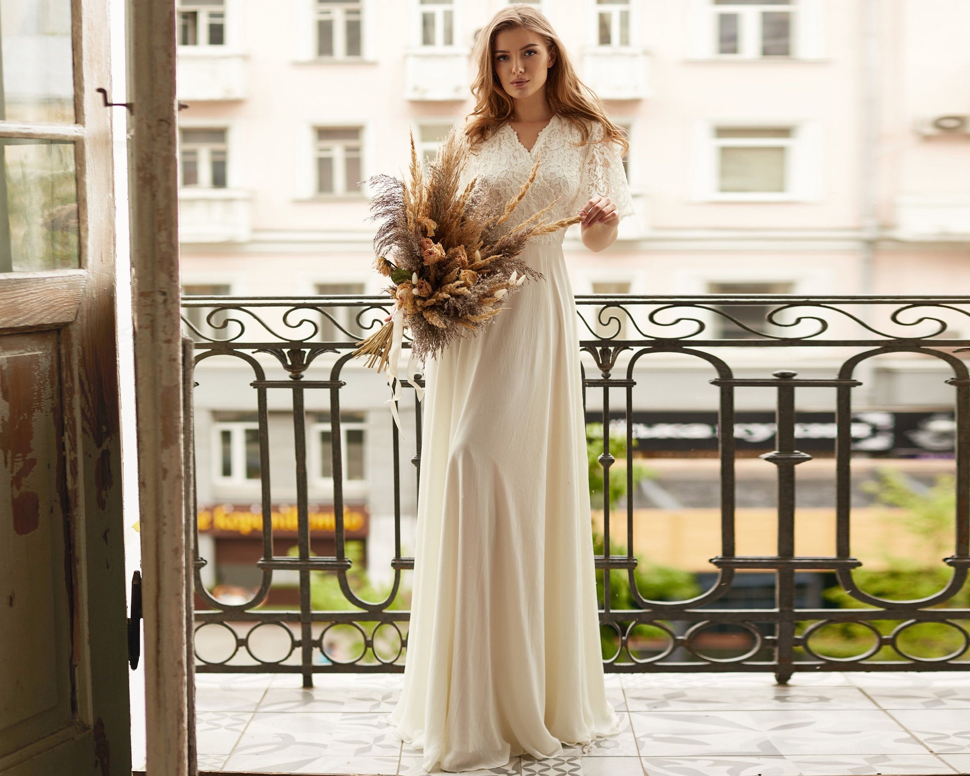 Simple wedding dress. Fit and flare chiffon  skirt, lace bodice, short wing sleeves.
Warm white color.
Perfect for bohemian bride, and rustic wedding.