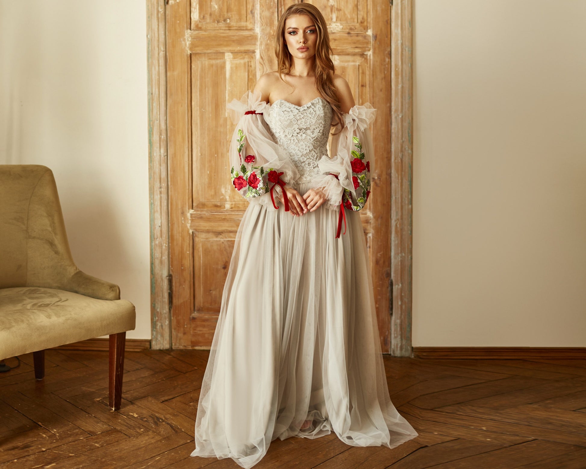 Bohemian wedding dress grey Color lace with detachable  tulle sleeves, and fit and flare grey tulle skirt.
Embroidered with red roses and decorated with red velvet ribbons. Perfect as a prom dress and alternative bride outfit.