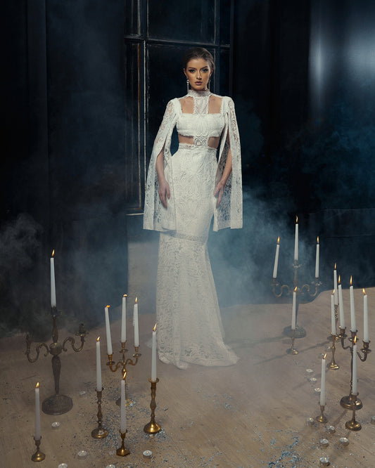 Custom made bohemian wedding dress made from thick lace and decorated with cord lace.
Mermaid silhouette, extra long sleeves with split. The dress has open back and stand collar.